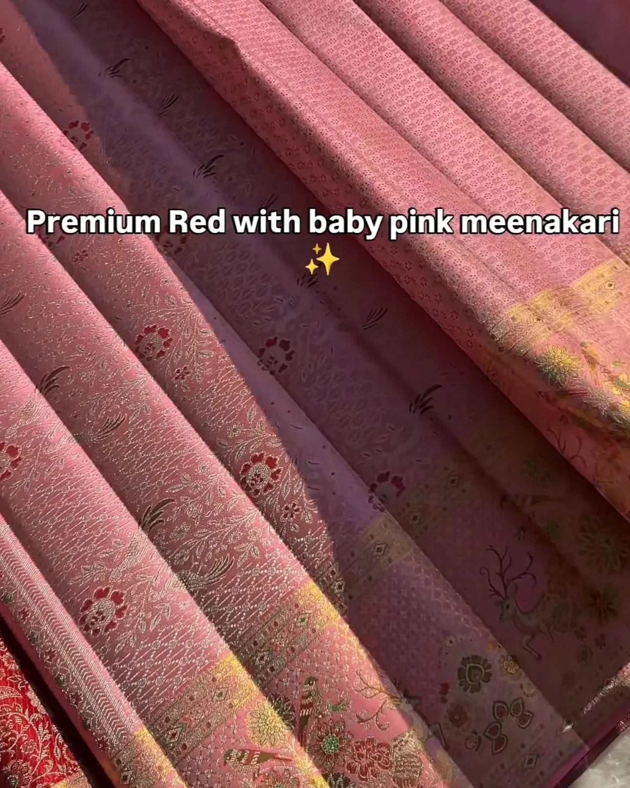 Close-up of pink fabric with baby pink meenakari patterns